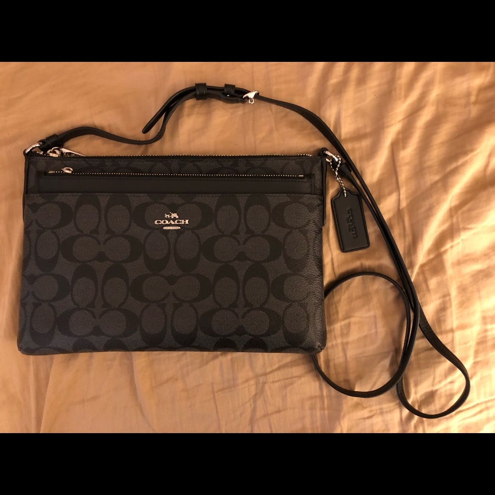 Coach®️ black crossbody bag with pop-up pouch